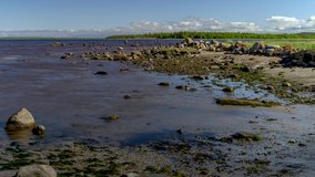 From high tide to low tide time lapse. The beach in Karelia