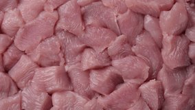 Chopped raw turkey meat top view, rotation