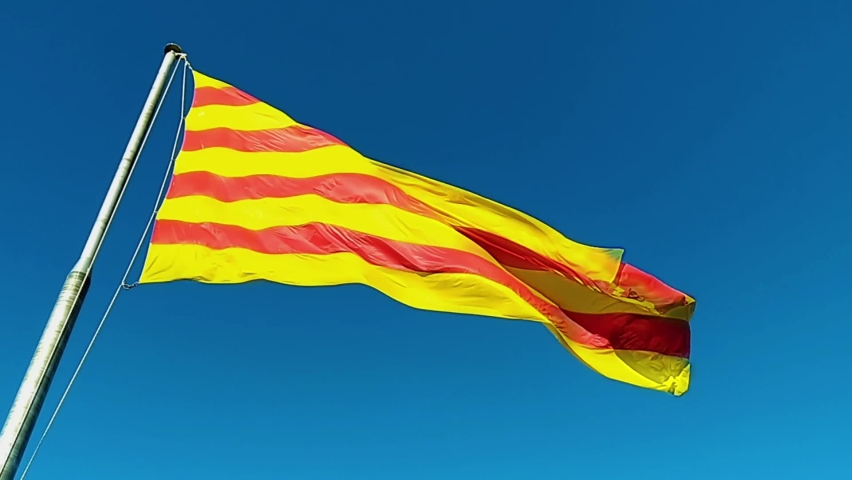 Flag of Catalonia. Sanyor flies over Barcelona