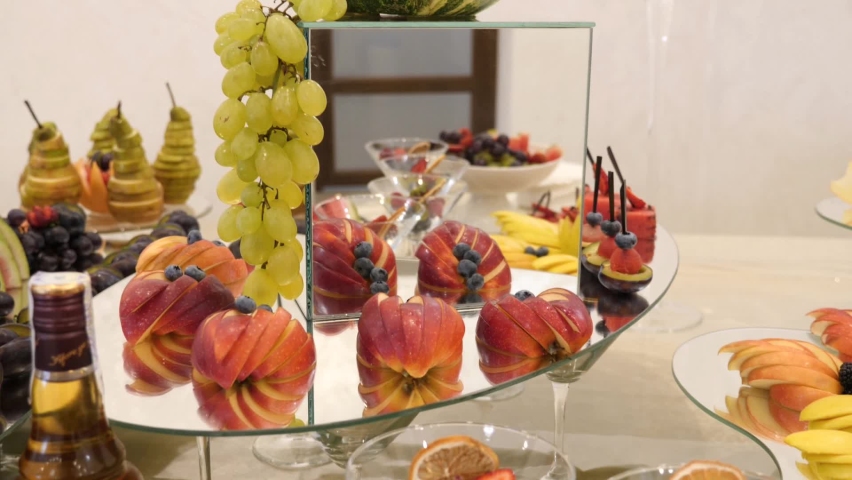 Fruit table. Grapes, pineapples, oranges, tangerines, etc. Buffet table design.