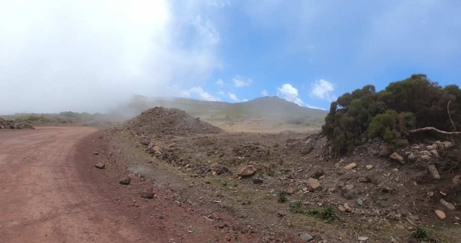 Drive in road to top of the Ethiopian Bale Mountains National Park. Ethiopia wilderness pure nature. Sunny day with blue sky.