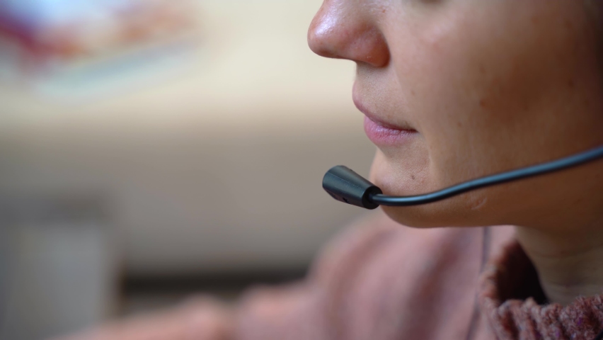 Call center concept. Close-up telesales agent with headset working from home Royalty-Free Stock Footage #1093748931