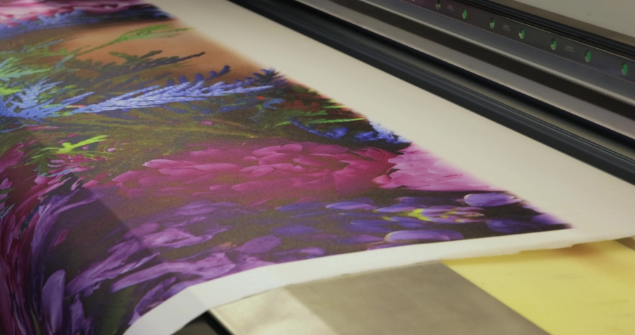 Industrial sublimation printer for digital printing on fabrics. Modern textile industry. Textile printing is the process of applying colour to fabric in definite patterns or designs. Royalty-Free Stock Footage #1093749743