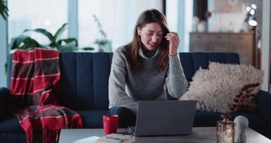 Young Caucasian Woman Entrepreneur Leading Corporate Video Conference Communication with Business Colleagues Staying Home Using Laptop and Earphones.