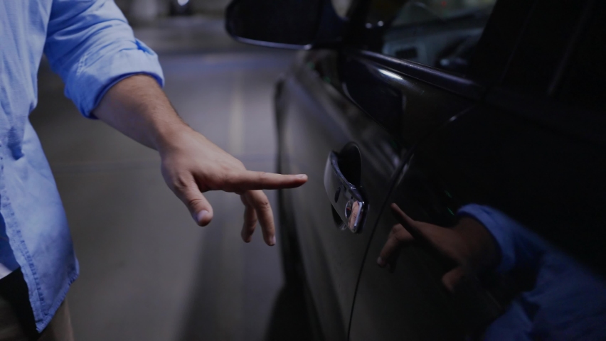 man's hand in the parking lot static electricity shock from the car door close-up Royalty-Free Stock Footage #1093755179