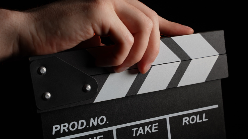 Movie Clapperboard or Film Clapperboard, Close Up. Film Movie Clapboard Accessory Device Using in Filmmaking and Video Production to Synchronizing of Picture and Sound. Start Filming Movie. Clap Mark. Royalty-Free Stock Footage #1093756497