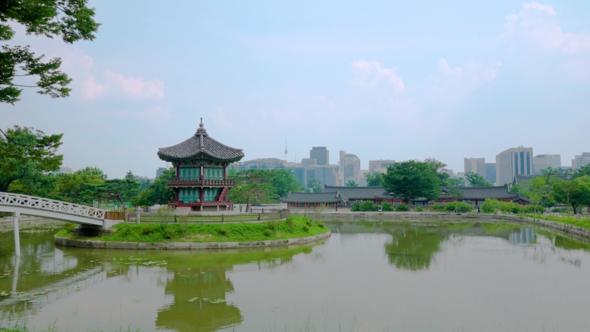 Beautiful sunset view of Hyangwonjeong Pavilion at Gyeongbokgung Palace in Seoul, South Korea.