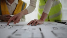 Closeup of hands engineer and architect team discussed about construction and architectural drawings works. - Powered by Shutterstock - Get 15% off with code: PIKWIZARD15