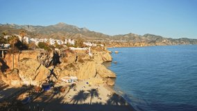 Aerial Drone View of Beautiful Beach on Mediterranean Coast of Spain at Nerja, Costa Del Sol in Andalusia (Andalucia), Mountains and Blue Ocean Sea Water on Sunny Day With Clear Blue Sky in Europe