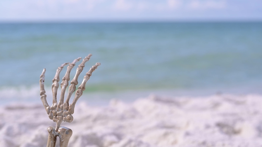 skeleton on bench enjoying white sand beach Royalty-Free Stock Footage #1093770549