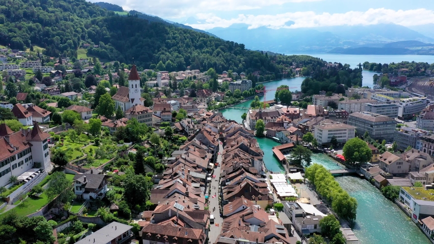 Panorama of Thun city with Alps and Thunersee lake, Switzerland. Historical Thun city and lake Thun with Bernese Highlands swiss Alps mountains in background, Canton Bern, Switzerland.