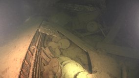 Scuba divers swims on the Shipwreck. Wreck diving. Mediterranean sea, Cyprus. Maritime disasters. Underwater 4K video filming Shot Of Sunken Ship. World tragedies under water undersea.