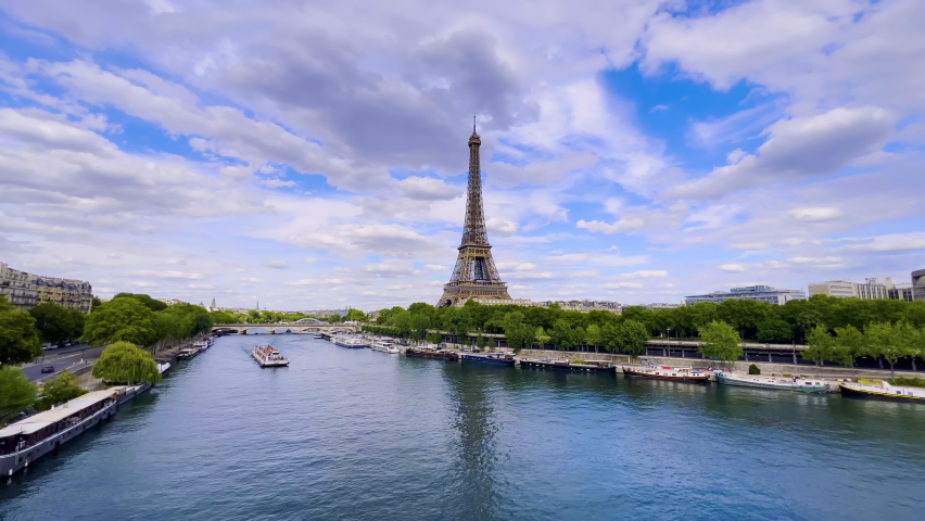  Aerial drone distant sunset view of Tour Eiffel Tower and Seine River bridge traffic cars driving, Paris city attractions, France  Royalty-Free Stock Footage #1093785341