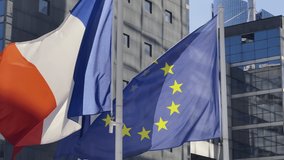 France and EU flag on flagpole excellent quality. French Republic and The European Union waving flag in wind background building glass skyscraper in Paris - Powered by Shutterstock - Get 15% off with code: PIKWIZARD15