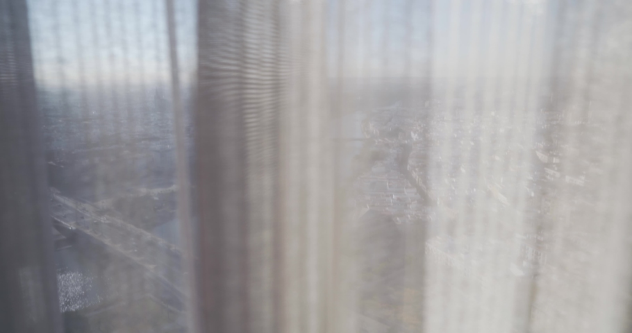 zoom view Revealing Curtains And Looking Outside Sevilla aerial view from skyscrapper tower