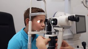 examination of a child with a cutting lamp, a microscope, and a focused light source. device for high-precision examination of the eye to determine the condition of the lens, the cornea.	
 - Powered by Shutterstock - Get 15% off with code: PIKWIZARD15