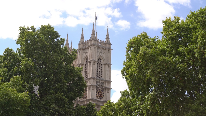 Close up view of the tower of Westminster Abbey viewed through the trees in the daytime