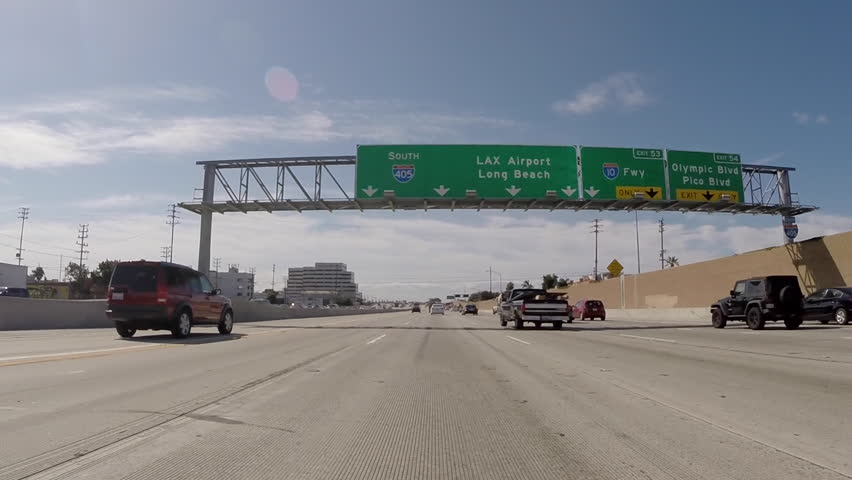 LOS ANGELES, CALIFORNIA, USA - July 10, 2015:  Overhead airport and Long Beach sign on the 405 San Diego Freeway North.