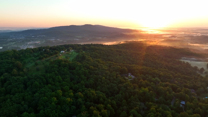 Shenandoah Mountains in USA at sunrise. Beautiful aerial with colorful horizon glow.