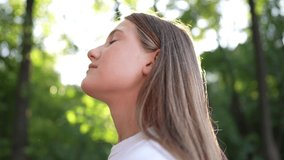 happy teenage girl closed her dream eyes in the park. teenager wants a dream portrait at sunset forest. woman daughter silhouette dream of a happy childhood. free face sister closed eyes lifestyle - Powered by Shutterstock - Get 15% off with code: PIKWIZARD15