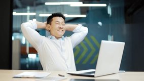Asian specialist Employee job done Satisfied office worker leaning back businessman relaxing after hard working day finished project on computer stretching at workplace Glad happy manager eyes closed - Powered by Shutterstock - Get 15% off with code: PIKWIZARD15