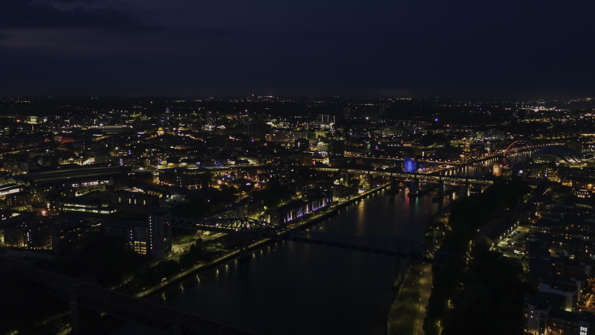 Establishing Aerial View Shot of Newcastle upon Tyne UK, Tyne and Wear, England United Kingdom deep night, slow push in