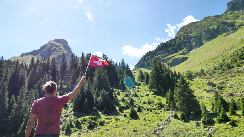  man with Swiss flag in Switzerland

