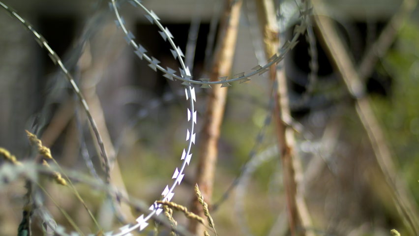 Ukraine war barbed wire. Destroyed Donbass.
Barrage against military invasion. 
Field military barrier, protection of civilians. 