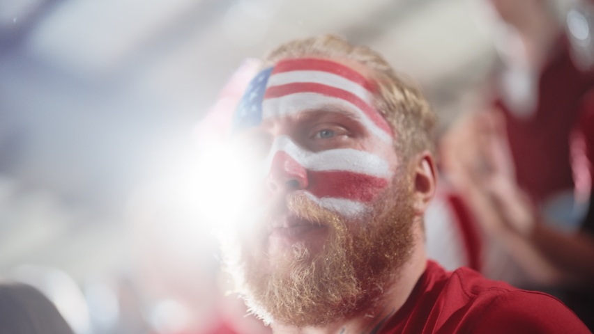 Sport Stadium Sport Event: Portrait of Handsome Man with U.S. Flag Painted Cheering for Red Americn Football Team to Win, Scream in Celebration of Victory. International Championship, World Tournament Royalty-Free Stock Footage #1093867075