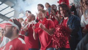 Sport Stadium Event: Crowd of Fans Cheer for their Red Soccer Team to Win. People Celebrate Scoring a Goal, Championship Victory. Group of Friends with Painted Faces Cheer, Shout, Have Emotional Fun - Powered by Shutterstock - Get 15% off with code: PIKWIZARD15