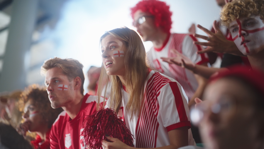 Sport Stadium Sport Event: Beautiful Cheering Girl. Crowd of Fans with Painted Faces Cheer, Shout for their Red Soccer Team to Win. People Celebrate Scoring a Goal, Championship Victory. Slow Motion