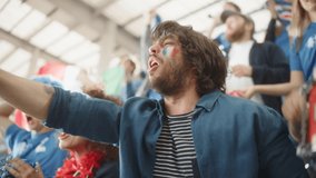 Sport Stadium Soccer Match: Portrait of Excited Hispanic Couple with Italian Flag Painted Faces Cheering Team to Win, Scream, Beg, Laugh. Crowd Celebrate Goal, Championship Victory. Slow Motion - Powered by Shutterstock - Get 15% off with code: PIKWIZARD15