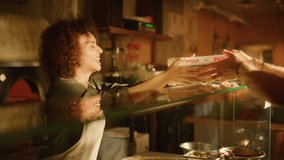 In Small Business Family Restaurant: Professional Couple of Chefs Preparing Pizza, Traditional Family Recipe, Giving Boxes to a Happy Customer. Online Order Delivery Pizzeria, Cooking Organic Food - Powered by Shutterstock - Get 15% off with code: PIKWIZARD15