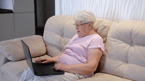 Senior mature older woman watching business training, online webinar on laptop computer remote working or social distance learning from home. 60s businesswoman video conference calling in virtual chat