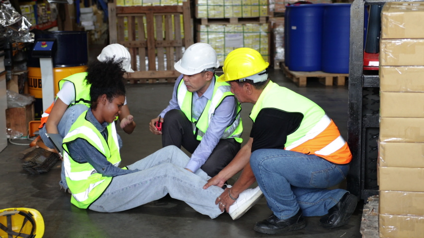 First Aid and safety first concept. Warehouse african female worker lying down on floor after accident in warehouse factory. Health insurance emergency accident  | Shutterstock HD Video #1093887899