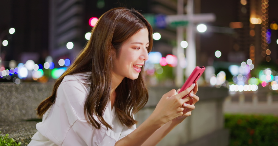 asian businesswoman use 5g smart phone outdoor on step cases at city in the evening Royalty-Free Stock Footage #1093888963