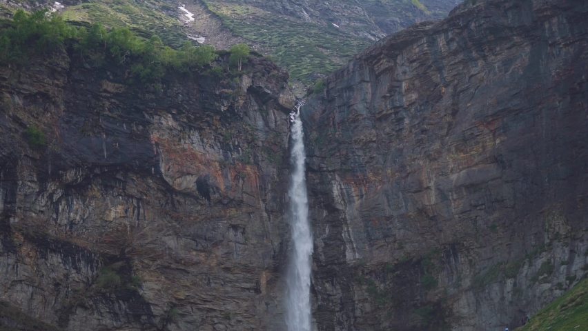 4K shot of Sissu waterfall at Lahual valley, Himachal Pradesh, India. Waterfall cascade on mountain rocks. Himalaya nature landscape. Northern India.  | Shutterstock HD Video #1093898477