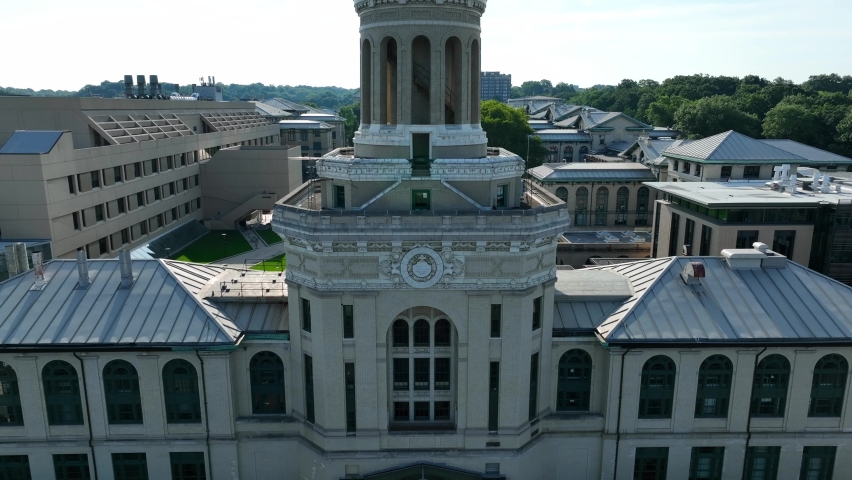 Hamerschlag Hall aerial rising shot. Stately academic building on Carnegie Mellon University campus. Beautiful college campus theme.