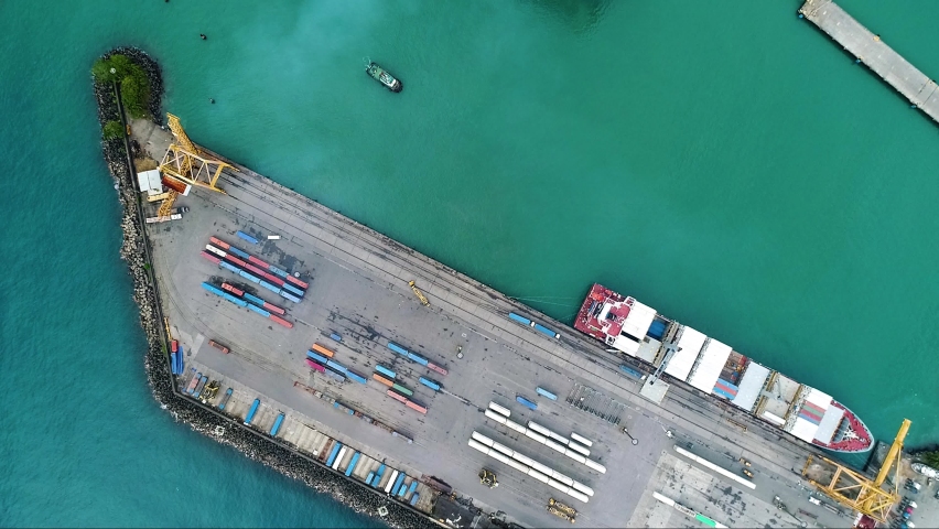 Intermodal Containers And Cargo Ship At The Container Terminal Of Puerto Limon In Costa Rica. aerial drone top-down