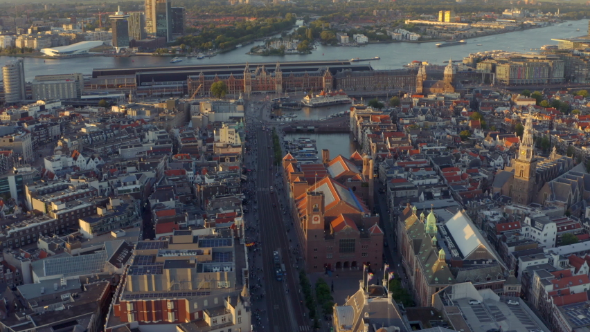 Circling drone shot over Damrak Amsterdam Central station