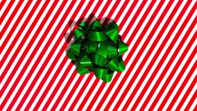 Unwrapping gift revealing a blue screen - Stop Motion Animation with Alpha Channel (Transparent Background) - Green bow on red and white wrapping paper