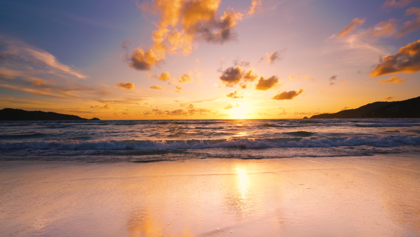 Beach sunset or sunrise sea ocean. Scene landscape twilight colorful golden sky horizon. Beautiful orange cloud morning sun light summer. Sun over mountains panorama. Text Space area.  