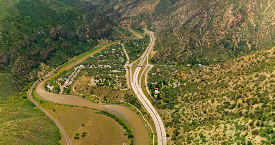 Delightful scenery of resort town in the mountains. Beautiful town locating between the river and speed highways. Top view.