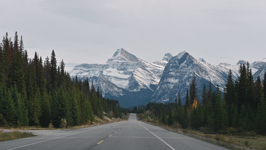 Scenic road trip with rocky mountain in autumn forest at Jasper national park, Alberta, Canada