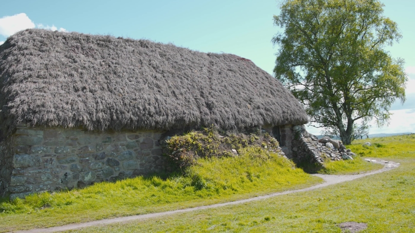 Old thatched stone cottage near Culloden battlefield site in Scotland.