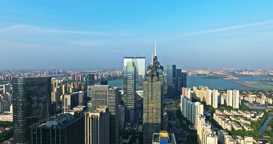 Aerial footage of city skyline and modern commercial buildings scenery in Suzhou, China. Famous CBD building complex in Suzhou.
