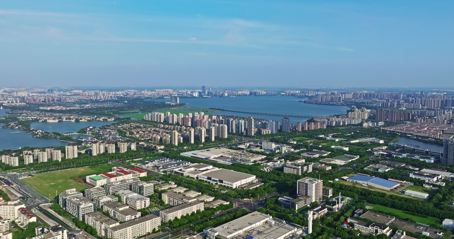 Aerial footage of city skyline and modern buildings scenery in Suzhou, China.