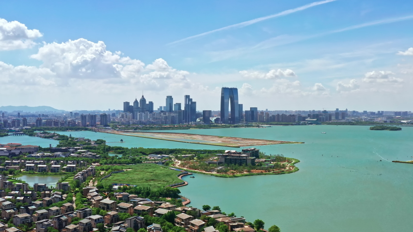 Cityscape of CBD in Suzhou Industrial Park, Jiangsu Province, China. Aerial footage of city skyline and beautiful lake scenery in Suzhou.