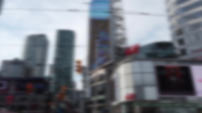 Yonge-Dundas Square, or Dundas Square. Public square at the southeast corner of the intersection of Yonge Street and Dundas Street East in Downtown Toronto, Ontario, Canada. Out of focus.