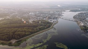 ultra hd video footage 4k Balloons fly over the Volga River in Russia. Expanse of the riverside of the Volga near the city of Kostroma at summer  sunset